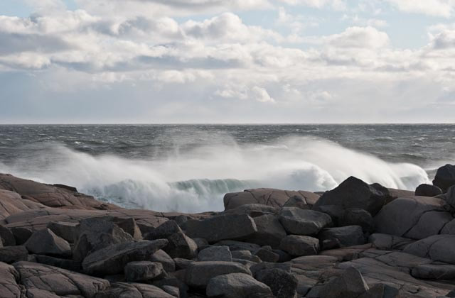 Spectacular waves crashing the Peggy's Cove shoreline during rough sea conditions. 