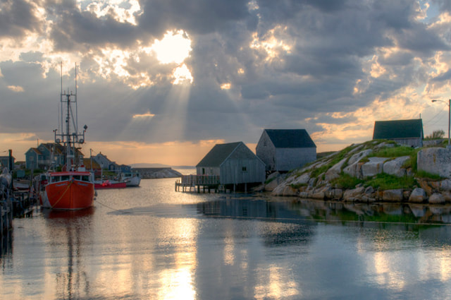 Dramatic skies and calm waters add to the natural beauty of Peggy's Cove, Nova Scotia.